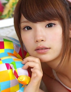 Manami Sato with sexy curves in bath suit plays with pillow