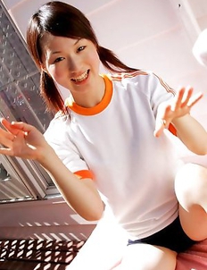 Naoko Sawano in sports outfit plays with balls in garden