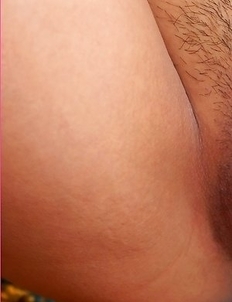 Venus Willa lies on a carpet and she decides to give her body a nice rub down.