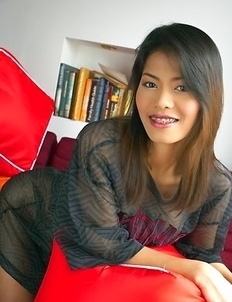 Check out amazing Ning Nara as she poses for the cameras in the living room. She looks so sweet and cute in her sheer t-shirt, but she knows that she