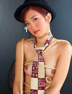 Gorgeous Martiny Mae is sitting on her chair and playing with herself.