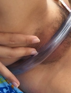 Sit back and relax while you watching lovely Cindy Kumolpis having a lot of fun with her rubber hose.