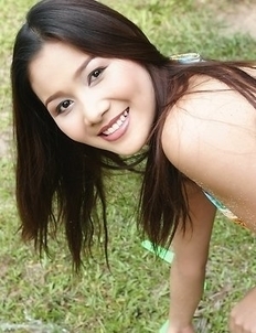 Don't miss the sexy Arisa Sunaree as she models her bikini on the beach. Arisa lies on the rocks and poses.