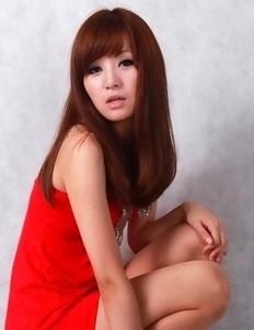 Sandy on heels shows hot behind in red dress for pictures
