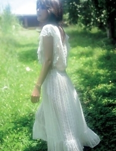 Neo babe in white dress loves feeling her body in water