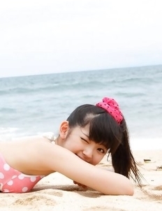 Airi Suzuki in cute bath suit enjoys hot sand on her curves