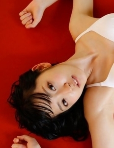 Airi Suzuki in bath suit enjoys petals all over her body