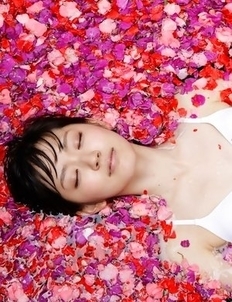Airi Suzuki in bath suit enjoys petals all over her body