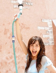 Rola Chen plays with outdoor shower on body over lingerie