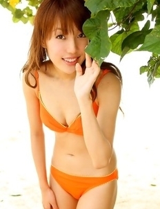 Nozomi Kawasaki is naughty and spreads legs on the beach