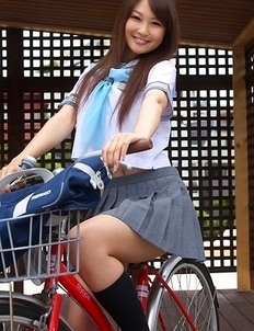 Misaki Nito in school uniform goes to classes riding bike