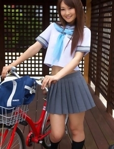 Misaki Nito in school uniform goes to classes riding bike