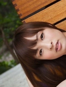 Maho Kiruma shows sexy curves in bath suit in her garden