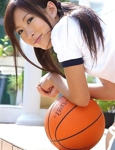 Ayaka Enomoto in sports outfit plays with ball outdoor