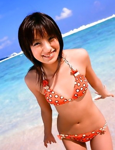 Akina Minami in colorful bath suits plays with big ball