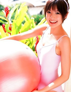 Akina Minami in colorful bath suits plays with big ball