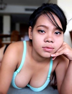 Chubby and cute Thai Wa with beautiful heavy-hangers pleasing white traveler in hotel room