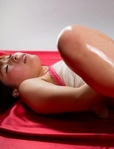 Oily beauty Ruru Sakurai teasing her hairy pussy while lying flat on her back