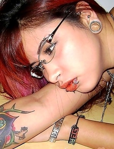 Inked and pierced asian chick