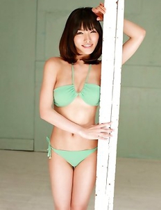 Anna Konno in green bath suit and heels is sexy and playful