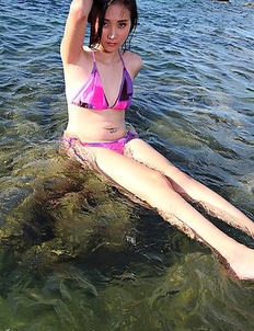 Asian Lolita Cheng posing in the sea