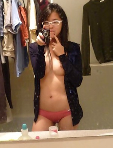Naughty Thai teen babe goes topless