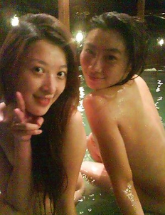 Naughty Asian teens go topless at the spa