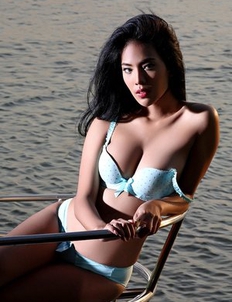 Skinny Asian Brunette Arya  is posing on a boat