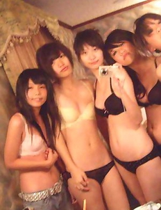 Korean chicks posing naked in a hotel room