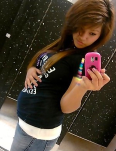 Busty chick infront of the mirror