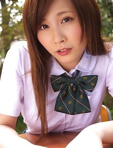 Schoolgirl Iyo Hanak poses at the open air in sexy skirt