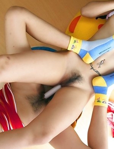 Ae and Yoko sit next to each other and begin touching their own bodies.