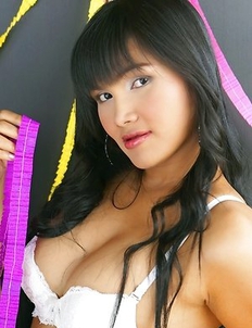 Betsy Rue is wearing a hot white bra and black and white panties.