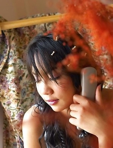 Dollar Dolaya takes out a red dildo and she places it inside of her vagina.