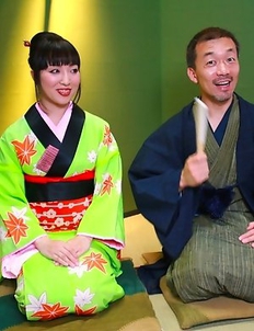 Asian babe sucking a large dick