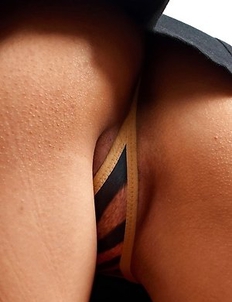 Red-haired girl Jasmine Mookjai pulls her panties off to show her pussy