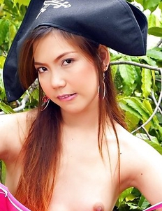 Ying Charintip in a pirate hat arranges a striptease on the street