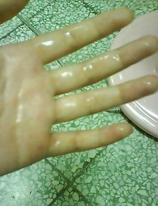 Horny asian teen fingering her wet pussy and making pics