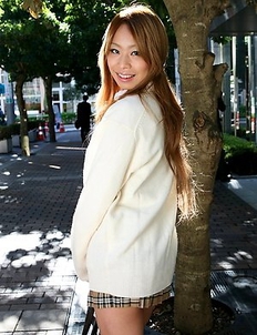 Remika Uehara poses on the street