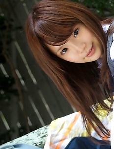 Manami Sato in short uniform skirt spends time in the park