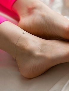 Pantyhose teen Mizuki poses on all fours with a vibrator pleasuring her pussy